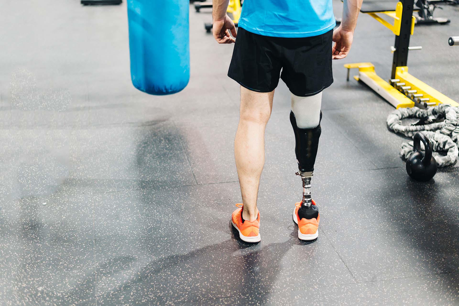 An athlete with leg prosthesis training at the gym - Pain relief at California Sports and Spine Center